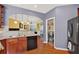 Updated kitchen with stainless steel appliances, wood cabinets, and open access to the dining room at 2685 Sardis Chase Ct, Buford, GA 30519