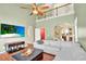 Spacious living room with high ceilings, a fireplace, and hardwood floors, creating a warm atmosphere at 2685 Sardis Chase Ct, Buford, GA 30519