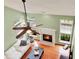 Open living room with hardwood floors, fireplace, and multiple windows at 2685 Sardis Chase Ct, Buford, GA 30519
