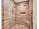 Tiled shower with dual shower heads, corner bench, and built-in niche at 2685 Sardis Chase Ct, Buford, GA 30519