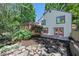 Beautiful backyard featuring a deck, lovely landscaping, and pink patio doors at 4655 Latimer Ne Ct, Kennesaw, GA 30144