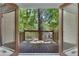 Private balcony features wooden railing and view of lush backyard at 4655 Latimer Ne Ct, Kennesaw, GA 30144
