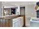 Attractive basement bar area with dark trim, built in cabinets, and counter seating at 4655 Latimer Ne Ct, Kennesaw, GA 30144