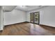 Finished basement with wood flooring and glass doors leading to the exterior at 4655 Latimer Ne Ct, Kennesaw, GA 30144