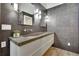 Modern bathroom features dual sinks, textured walls, and decorative lighting at 4655 Latimer Ne Ct, Kennesaw, GA 30144