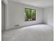 Bright bedroom with a large window and neutral carpet, providing a cozy and inviting atmosphere at 4655 Latimer Ne Ct, Kennesaw, GA 30144