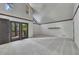 Bright and spacious bedroom featuring vaulted ceiling, gray carpet, and balcony doors at 4655 Latimer Ne Ct, Kennesaw, GA 30144