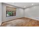 Bedroom with wood floors, a large window, and neutral wall color at 4655 Latimer Ne Ct, Kennesaw, GA 30144