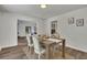 Bright dining area with hardwood floors and neutral decor, perfect for entertaining and comfortable meals at 4655 Latimer Ne Ct, Kennesaw, GA 30144