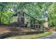 Two-story home with a lush, wooded lot and mature landscaping for ultimate privacy and curb appeal at 4655 Latimer Ne Ct, Kennesaw, GA 30144