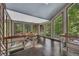 Bright hallway with large windows overlooking a green landscape and sleek metal railings for a modern touch at 4655 Latimer Ne Ct, Kennesaw, GA 30144