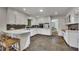 Bright kitchen featuring white cabinets, stainless appliances, and dark backsplash at 4655 Latimer Ne Ct, Kennesaw, GA 30144