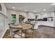 Cozy eat-in kitchen featuring white cabinets, stainless appliances and dining area at 4655 Latimer Ne Ct, Kennesaw, GA 30144