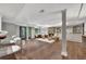 Finished basement with living area, stone fireplace, hardwood floors, built-in shelves, and walkout to the yard at 4655 Latimer Ne Ct, Kennesaw, GA 30144