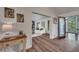 Inviting entryway flows into living room with hardwood floors and stylish decor, creating a warm ambiance at 4655 Latimer Ne Ct, Kennesaw, GA 30144