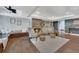Charming living area with hardwood floors, a stone fireplace, and custom bench seating create a cozy and inviting atmosphere at 4655 Latimer Ne Ct, Kennesaw, GA 30144