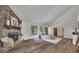 Spacious living room has a stone fireplace, hardwood flooring, and lots of natural light from large windows at 4655 Latimer Ne Ct, Kennesaw, GA 30144