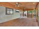 Spacious screened-in porch with wood floors, ceiling fans, and backyard access at 4655 Latimer Ne Ct, Kennesaw, GA 30144