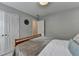 Cozy bedroom with plush bedding and a decorative floral wall piece at 10000 Barston Ct, Johns Creek, GA 30022