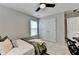 Bedroom with a window and closet providing natural light at 10000 Barston Ct, Johns Creek, GA 30022