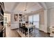 Bright dining room with hardwood floors, decorative art, and a modern light fixture at 10000 Barston Ct, Johns Creek, GA 30022