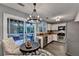Eat-in kitchen with stainless steel appliances and sliding glass doors to the deck at 10000 Barston Ct, Johns Creek, GA 30022