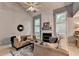 Bright living room features fireplace, soaring ceilings, large windows, and plush seating at 10000 Barston Ct, Johns Creek, GA 30022