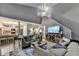 Open-concept living room features soaring ceilings, comfortable seating, and seamless flow into the kitchen at 10000 Barston Ct, Johns Creek, GA 30022