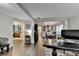 Expansive open-concept living and dining areas featuring hardwood floors, offering a modern feel at 10000 Barston Ct, Johns Creek, GA 30022