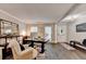 Inviting living room featuring hardwood floors, neutral paint, and elegant furnishings at 10000 Barston Ct, Johns Creek, GA 30022