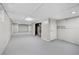 Unfinished basement with painted walls, a drop ceiling, and ample room for storage at 2215 Springdale Sw Rd, Atlanta, GA 30315