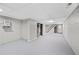Spacious basement with white painted walls, block foundation and stairs leading to the upper level at 2215 Springdale Sw Rd, Atlanta, GA 30315