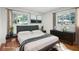 Bedroom with modern furniture, a large window, and a soft rug for comfort at 2215 Springdale Sw Rd, Atlanta, GA 30315