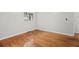 Bright bedroom features hardwood floors and a window letting in natural light at 2215 Springdale Sw Rd, Atlanta, GA 30315