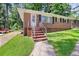 Charming brick ranch-style home featuring a well-maintained lawn and mature trees at 2215 Springdale Sw Rd, Atlanta, GA 30315