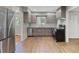 Modern kitchen featuring stainless steel appliances and gray wood-tone cabinets at 2215 Springdale Sw Rd, Atlanta, GA 30315