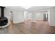 Open-concept living area with hardwood floors and a fireplace at 2215 Springdale Sw Rd, Atlanta, GA 30315