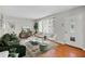 Bright living room with hardwood floors, modern furniture, and large windows at 2215 Springdale Sw Rd, Atlanta, GA 30315