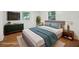 Inviting main bedroom with natural light, a queen sized bed, and stylish decor at 2215 Springdale Sw Rd, Atlanta, GA 30315