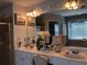 Bright bathroom with a double vanity, walk-in shower, and tile floors at 3692 Ramsey Cir, Atlanta, GA 30331