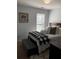 Bedroom with a queen bed, neutral walls, and a large window that provides natural light at 3692 Ramsey Cir, Atlanta, GA 30331
