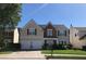 Charming two-story home with a well-manicured lawn and a two-car garage on a sunny day at 3692 Ramsey Cir, Atlanta, GA 30331