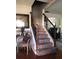Inviting foyer with hardwood floors, staircase, and decorative accents at 3692 Ramsey Cir, Atlanta, GA 30331