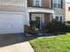Close-up of front entry with landscaping, two-car garage, and walkway at 3692 Ramsey Cir, Atlanta, GA 30331