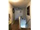 Upstairs hallway with neutral walls and carpet leads to secondary bedrooms and bathroom at 3692 Ramsey Cir, Atlanta, GA 30331