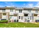 Townhome backyard featuring a grass lawn, patios, and a variety of air conditioning units at 420 Berckman Nw Dr, Lilburn, GA 30047