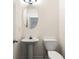 Clean and modern half bath with pedestal sink and oval mirror at 420 Berckman Nw Dr, Lilburn, GA 30047