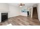 Large open floor plan with fireplace, hardwood floors, and stair access at 420 Berckman Nw Dr, Lilburn, GA 30047