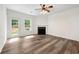 Spacious living room with fireplace, wood floors, and natural light at 420 Berckman Nw Dr, Lilburn, GA 30047