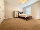 A cozy bedroom features neutral walls, carpet, and a comfortable bed with a dresser at 602 Summer Pl, Norcross, GA 30071